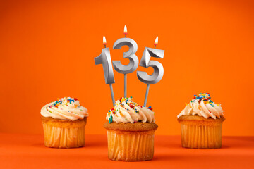 Birthday celebration in orange color - Candle number 135