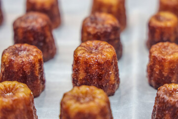 caneles de bordeaux. canelé is a small french pastry flavored with rum and vanilla with a soft and tender custard center and a dark, thick caramelized crust.