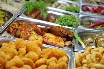 Various boiled, fried and deep-fried foods in fast food restaurant. Potatoes