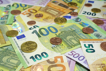 Euro banknotes, metal coins of various colors, size and nominals