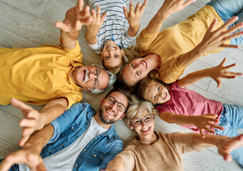 child family portrait woman mother man father grandmother daughter group smiling happy adult girl...