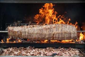 Wood fired Turkish Cag Kebab Doner. Cag kebab, a traditional Turkish cuisine dish made from lamb meat cooked on wood fire