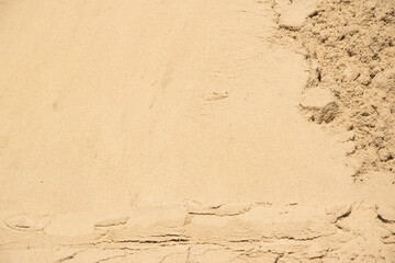 A close-up image of fine grain sand, revealing the intricate patterns and textures of the grains