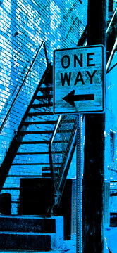 Filtered Photo of a One-Way Street Sign in front of an outdoor, open metal staircase by an Old Brick Wall of a downtown building-Urban Background, Backdrop, Border, Wallpaper, Frame in Blue