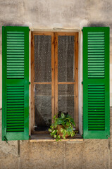Green shutters on the windows in spain