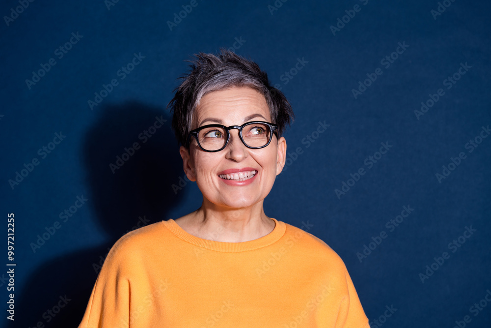 Sticker Photo portrait of lovely pensioner lady look empty space dressed stylish yellow garment isolated on dark blue color background