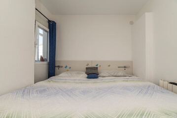 Small bedroom with large bed occupying