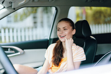 young woman smiling in car, casual outfit, interior shot, joyful expression, soft lighting, bright ambiance, comfortable atmosphere, driving concept, lifestyle moment