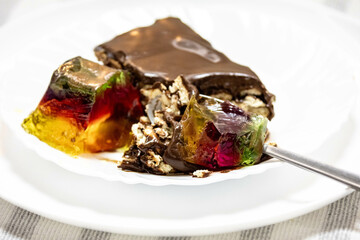Classic chocolate pavé served with colored gelatin. perfect combination of flavors