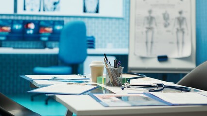 Empty medical facility with modern equipment designed for medicine in finding the right diagnostic, x ray machine and hospital records. Private clinic office space for healthcare industry.