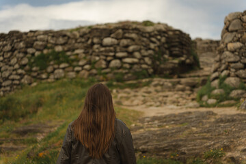 Female Tourist Exploring the Path to Castro de Baroña, Galicia