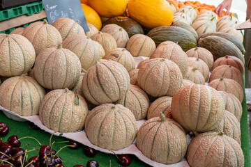 Sweet ripe cantalupe melons from Carpentras town for sale on farmers market, Provence, France