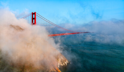 Golden Gate Bridge Shrouded in Mystical Fog Overlooking the Bay in San Francisco - California,...