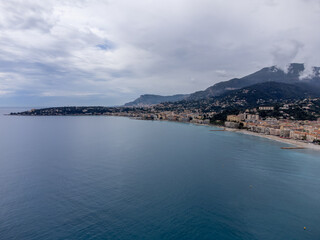 Obraz premium Aerial view on French Riviera, colorful Menton old city and marina on Mediterranean Sea near French-Italian border, travel destination, panoramic view from above