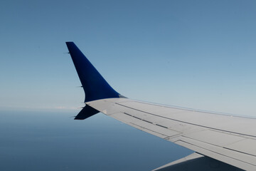 Obraz premium Airplane wing view from window during flight
