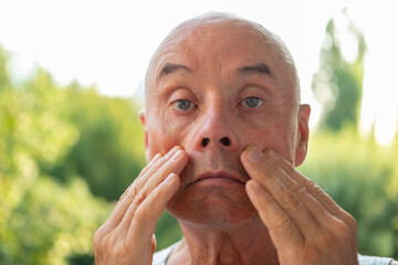 Charming mature man, senior 60 years old, age-related changes, aging gracefully, facial skin changes and gravitational ptosis, Aging gracefully, self-love