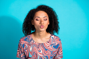 Photo portrait of pretty young girl pouted lips kiss closed eyes wear trendy colorful clothes isolated on aquamarine color background