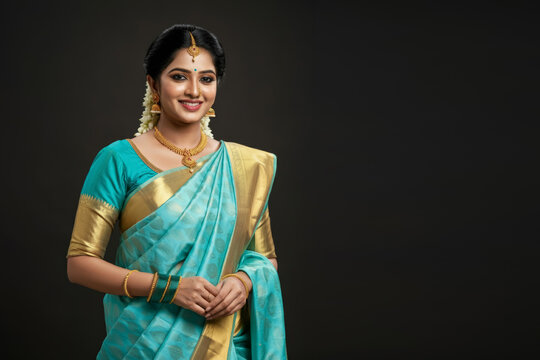 Beautiful gorgeous young indian woman in traditional saree - Powered by Adobe