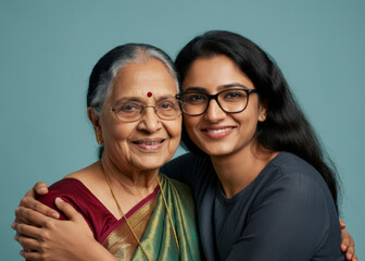 Happy indian elderly mom and young daughter hugging together. Happy life concept.