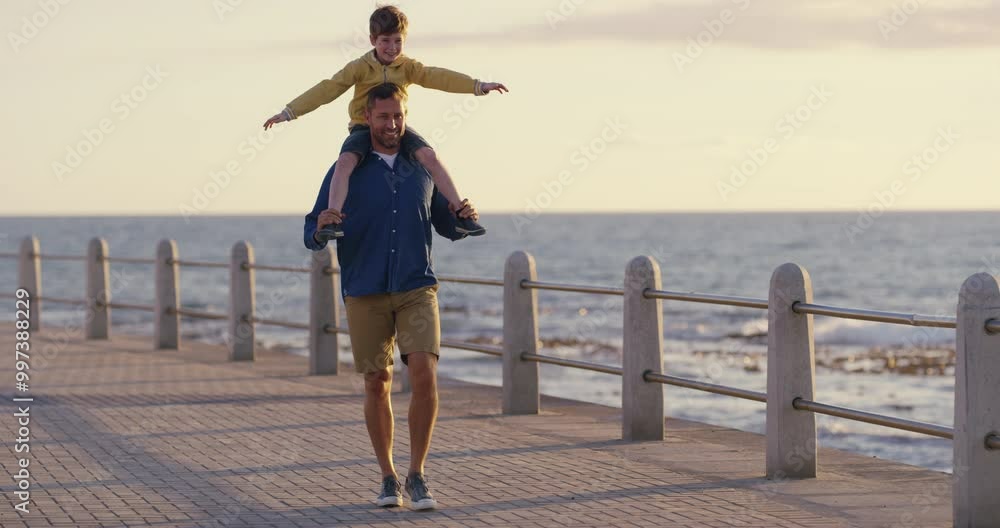 Canvas Prints Father and son bonding, playing and having fun on the beach as a family by the sea in summer. Dad carrying his boy child on his shoulders, walking and enjoying a day out by the ocean on vacation