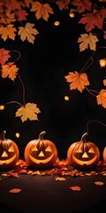 Decorative Halloween pumpkins with carved faces, autumn leaves, and a lantern