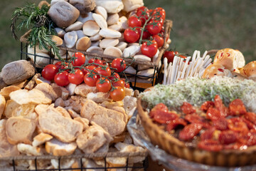 table with food breads, fruits cheeses party decoration healthy foods