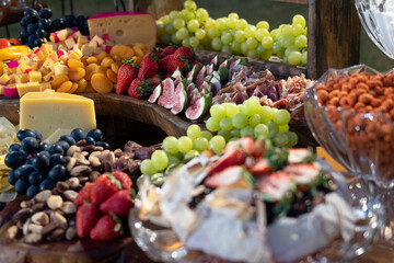 table with food breads, fruits cheeses party decoration healthy foods