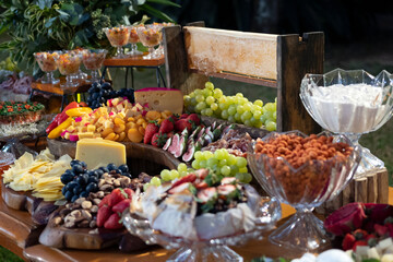 table with food breads, fruits cheeses party decoration healthy foods