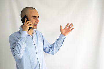 Young office worker arguing over his smart phone. Businessman talking on his phone.