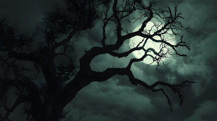 A dark, twisted tree with branches that resemble skeletal hands, reaching out into the night sky