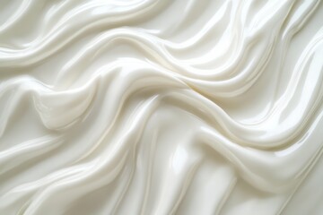 Obraz premium Close-up of smooth creamy swirls with a glossy texture showcasing soft white waves in high-quality clarity