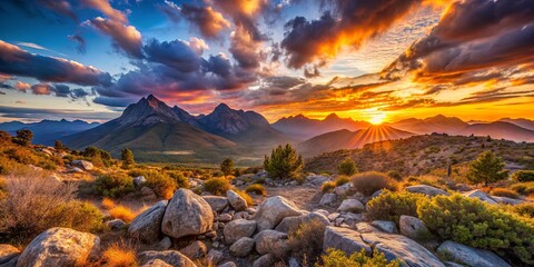 Golden rays of sunshine break through the clouds, illuminating the rugged mountain peaks and the lush green valley below.