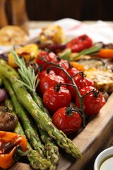 Delicious grilled vegetables with spices on table, closeup