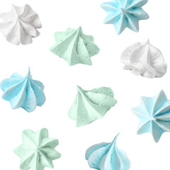 Delicious meringue cookies in air on white background