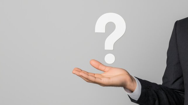 A person in a suit holds out their hand with a large question mark above, symbolizing curiosity and inquiries in a minimalist setting.