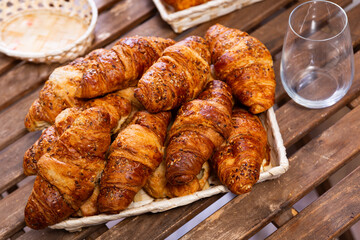 Delicious hot croissants on the breakfast table