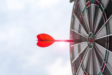 Dart board with red arrow for business planing and successful concept