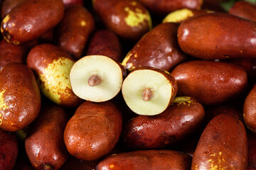 Fresh raw jujubes fruits on table.