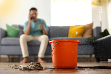 Emergency Roof Leaking Damage Water Leak Or Flood From Ceiling at Living Room
