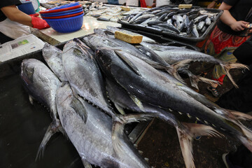 Early morning products and produce at Malaysian wet market selling fish beef chicken fruit vegetable grocery