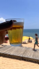glass of beer on the beach