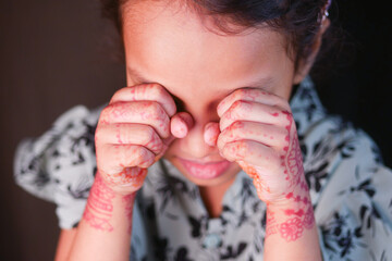 a upset child girl looking down 