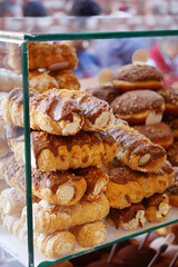 A Delicious and Tempting Assortment of Pastries Presented in a Bakery Display Case