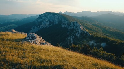 Fototapeta premium Mountainous Landscape with Grassy Ridge and Distant Peaks