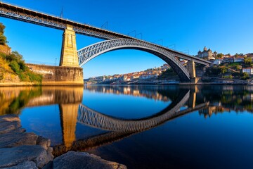 Fototapeta premium Hyper-realistic view of Portoâ€™s Dom LuÃ­s I Bridge, with every architectural detail of the bridge and the surrounding city captured in stunning clarity, including the reflections in the Douro