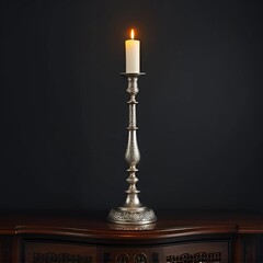 a candlestick with a candle on a black background