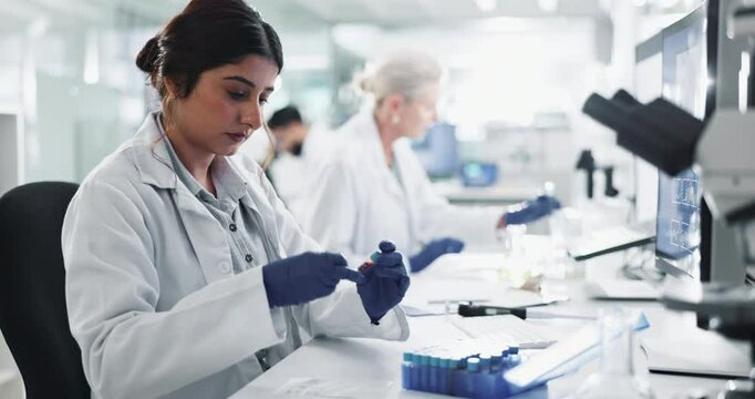 Woman, gloves and blood sample in lab with label for test, assessment or clinical analysis at pharma company. Scientist, person and glass container with dna, results and ppe with vaccine development