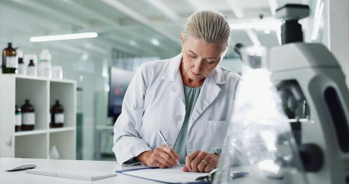 Woman, scientist and clipboard in lab for writing, stats and progress in clinical analysis. Mature person, study and research for notes, checklist and admin for vaccine development at pharma company