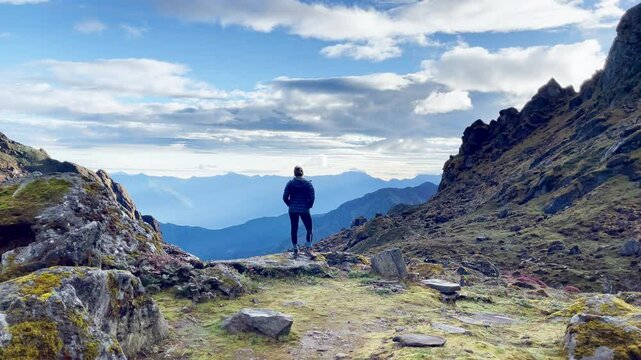 Lonely female enjoying Himalaya mountains Makalu Barun Park trekking route in Tulikharka 4100m. Mera peak climbing acclimatization walk. Active healthy life, traveling, sport mount climbing 4K video.