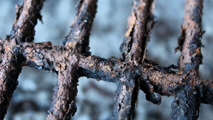 steel grating with heavy rust and corrosion oxidation texture grunge char background